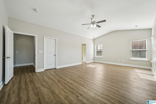 interior space featuring ceiling fan, dark hardwood / wood-style flooring, and vaulted ceiling