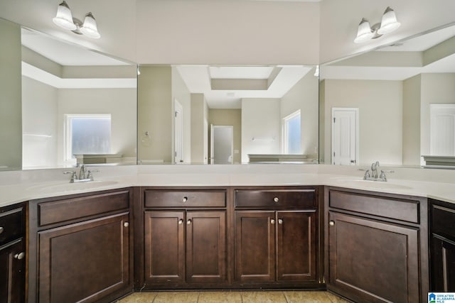 bathroom with plenty of natural light and vanity