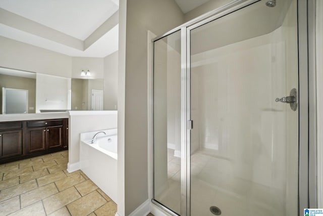 bathroom with shower with separate bathtub and vanity