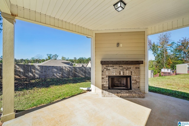 view of patio featuring exterior fireplace