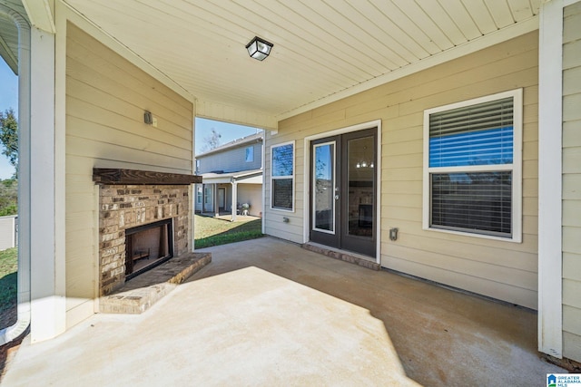 view of patio / terrace featuring an outdoor brick fireplace