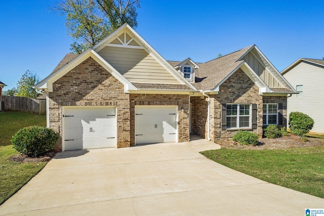 craftsman-style house with a front yard and a garage