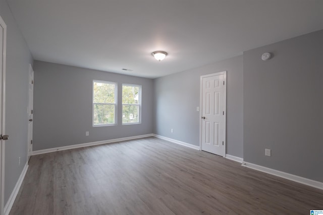 empty room featuring hardwood / wood-style flooring