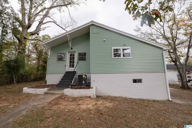 back of property with central air condition unit