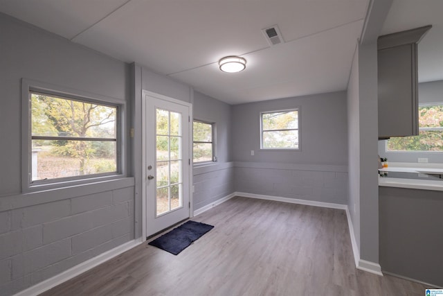 doorway with light hardwood / wood-style floors