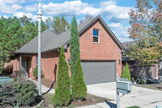 view of side of property featuring a garage