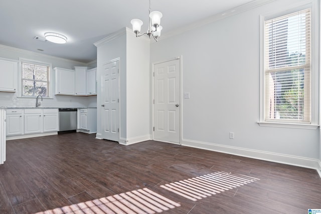 kitchen featuring stainless steel dishwasher, dark hardwood / wood-style floors, white cabinetry, and ornamental molding