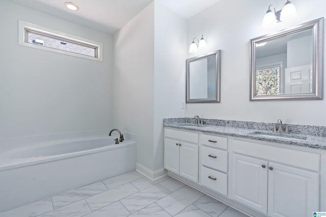 bathroom with vanity and a bathtub