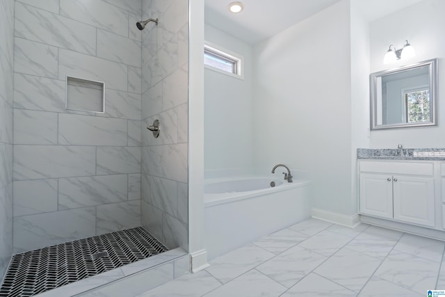 bathroom featuring vanity and independent shower and bath