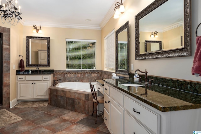 bathroom featuring tiled tub, crown molding, vanity, and a notable chandelier