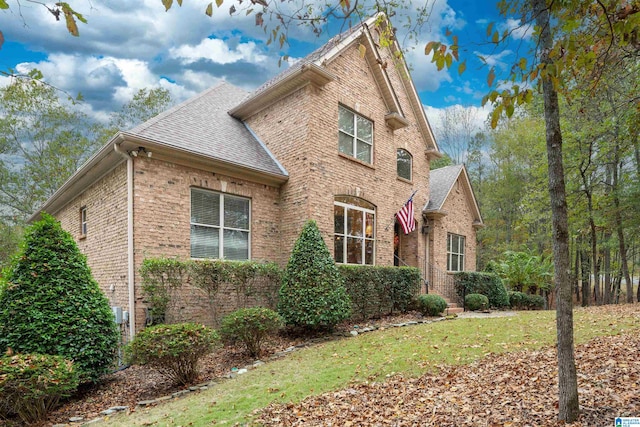 view of property exterior with a yard