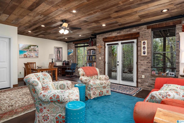 living room with ceiling fan, dark wood-type flooring, and wooden ceiling