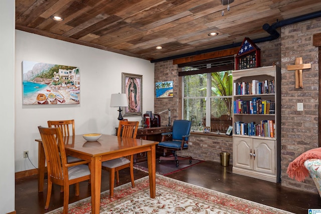 dining room featuring wooden ceiling and brick wall