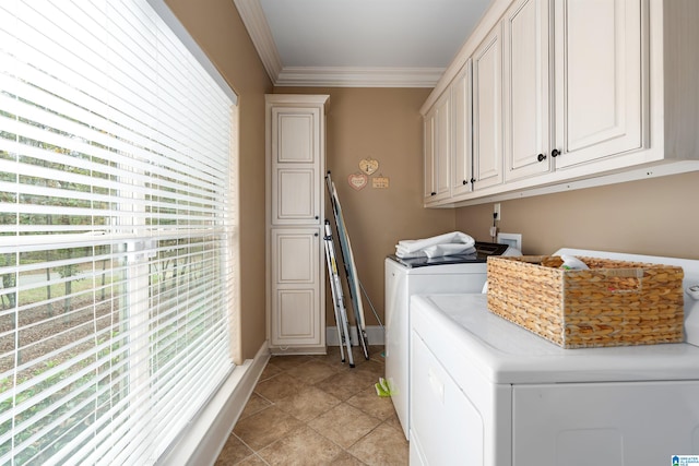 laundry area featuring cabinets, washing machine and dryer, crown molding, and light tile patterned flooring