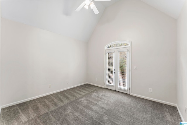 empty room featuring carpet, ceiling fan, french doors, and high vaulted ceiling