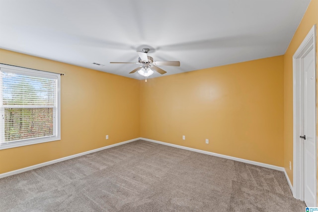 carpeted empty room with ceiling fan