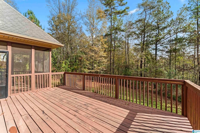 wooden deck featuring a sunroom