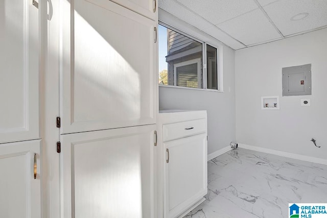 washroom featuring cabinets, washer hookup, hookup for an electric dryer, electric panel, and gas dryer hookup