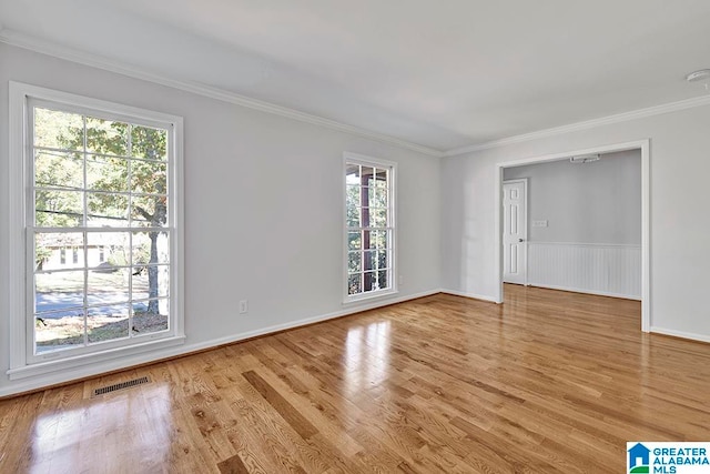 unfurnished room featuring hardwood / wood-style flooring and a wealth of natural light