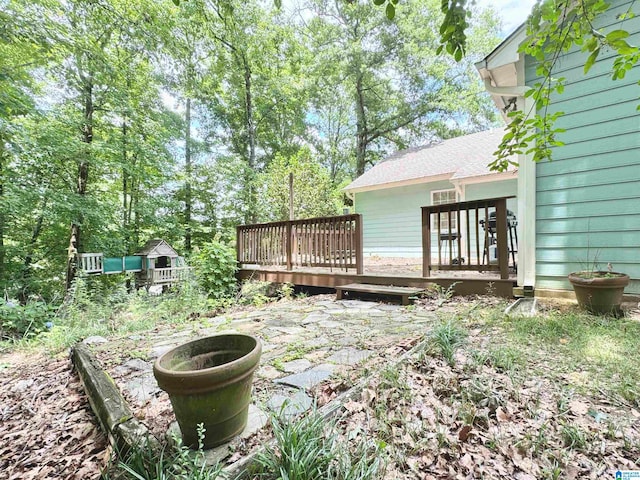 view of yard featuring a wooden deck