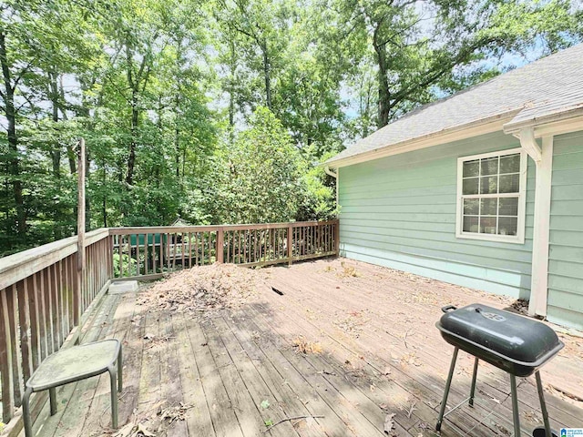 wooden deck with grilling area