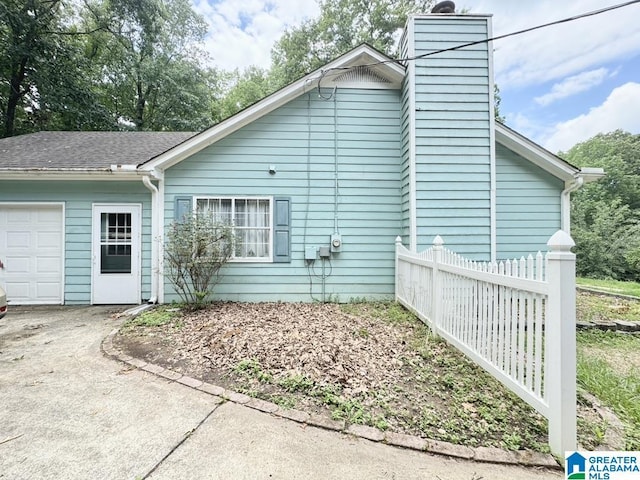 view of property exterior featuring a garage