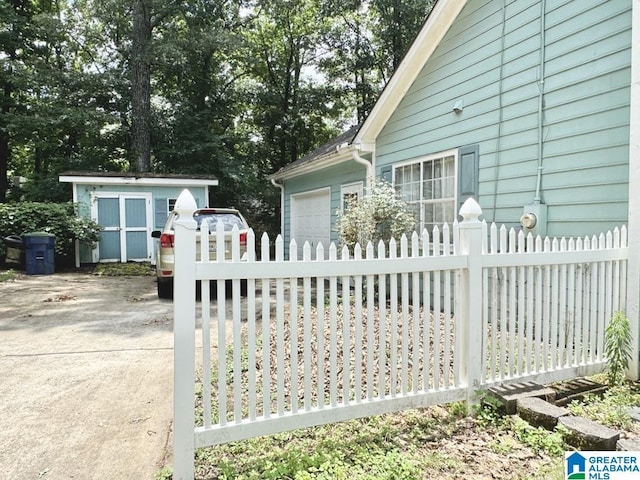 view of gate featuring a shed