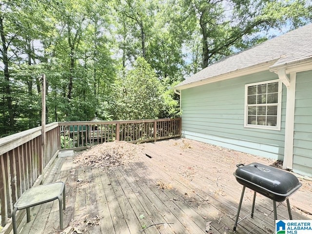 wooden deck featuring grilling area