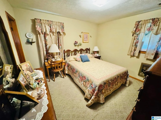 carpeted bedroom with a textured ceiling