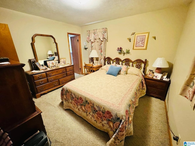 carpeted bedroom with a textured ceiling