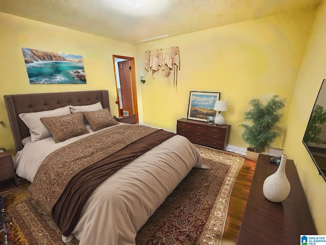 bedroom featuring dark hardwood / wood-style floors