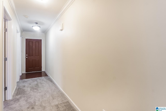 corridor featuring light colored carpet and crown molding