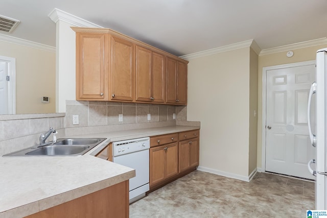 kitchen with white appliances, backsplash, crown molding, and sink