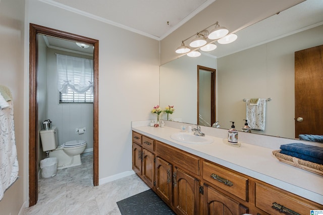 bathroom featuring vanity, toilet, and crown molding