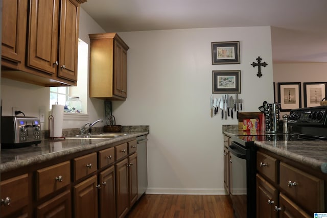 kitchen with dishwasher, dark hardwood / wood-style flooring, electric range, and sink