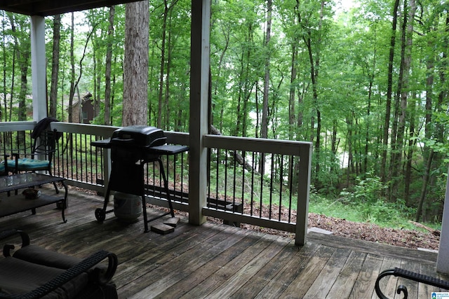 wooden terrace featuring area for grilling