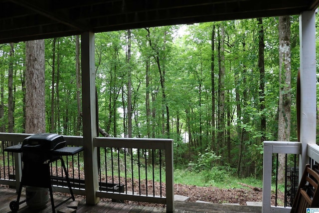 551 Poplar Pl, Wedowee, AL 36278 - wooden terrace with a grill and a view of trees