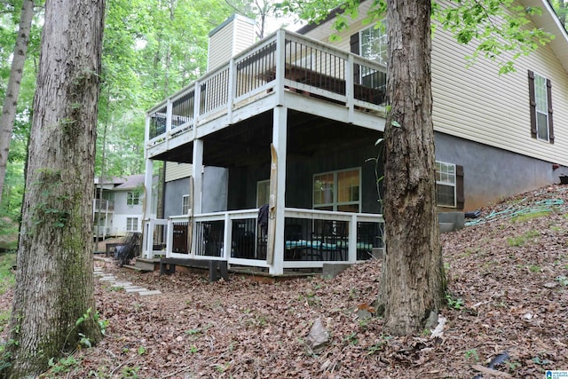 551 Poplar Pl, Wedowee, AL 36278 - rear view of house with a wooden deck and a sunroom