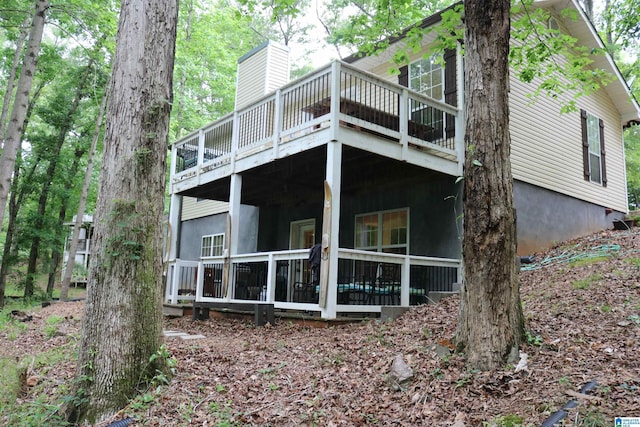 551 Poplar Pl, Wedowee, AL 36278 - rear view of property with a wooden deck and a chimney