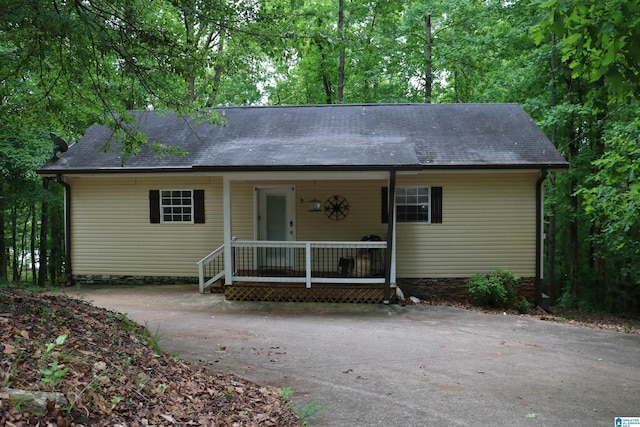 551 Poplar Pl, Wedowee, AL 36278 - view of front of home with driveway, roof with shingles, and a porch