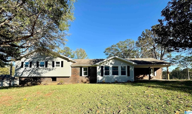 tri-level home with a front yard