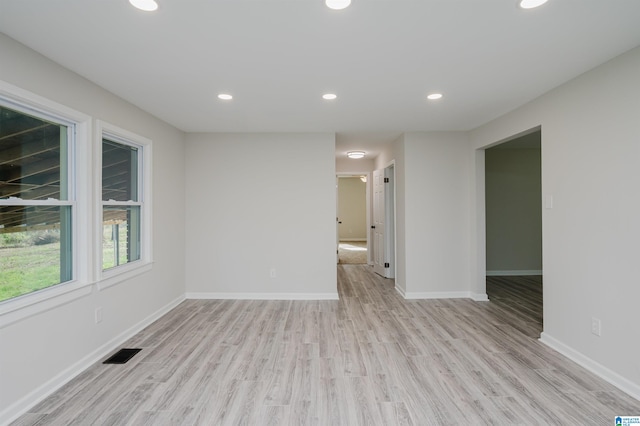 spare room featuring light wood-type flooring