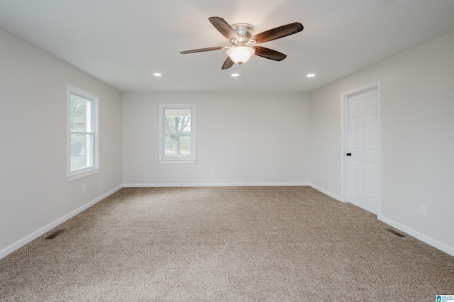 carpeted empty room with ceiling fan