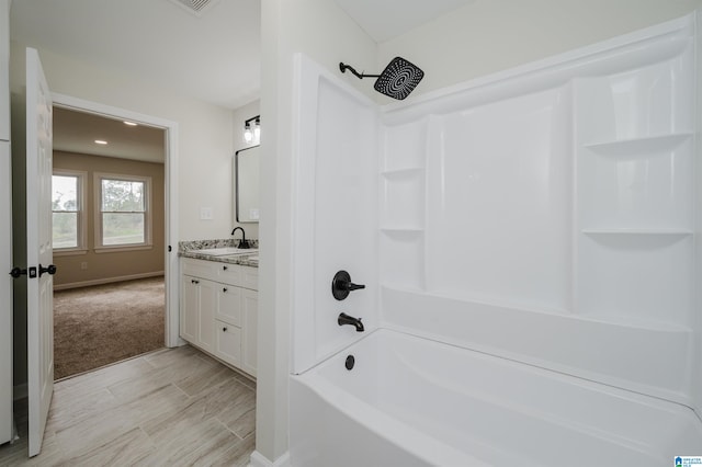 bathroom with shower / bathing tub combination and vanity