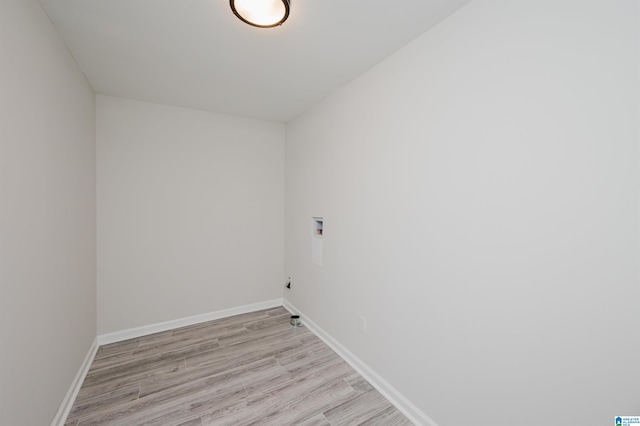 clothes washing area with washer hookup and light hardwood / wood-style floors