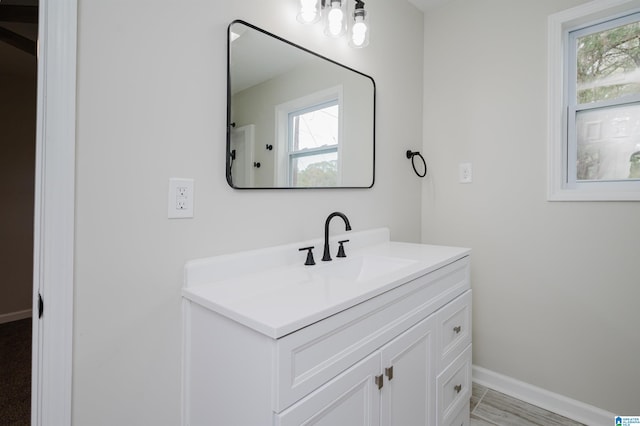 bathroom featuring vanity and a healthy amount of sunlight