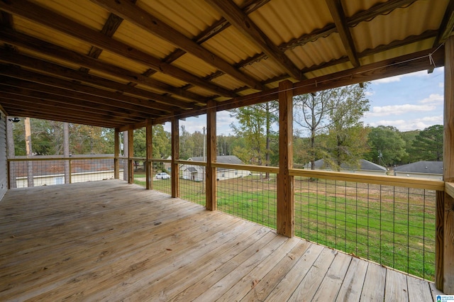 wooden deck featuring a lawn