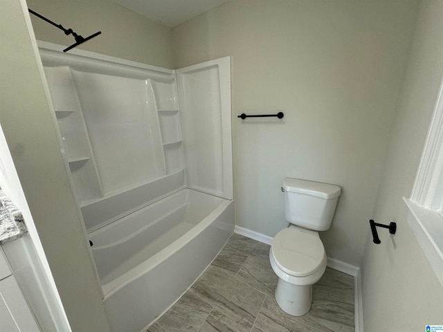 bathroom featuring toilet and shower / washtub combination