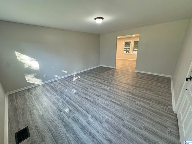 unfurnished room with hardwood / wood-style floors