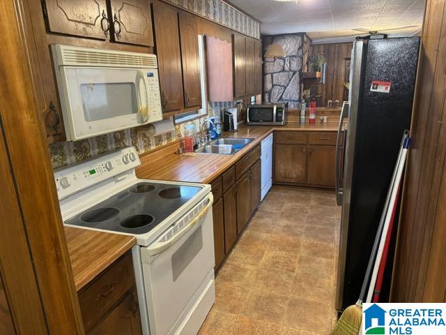 kitchen with sink and white appliances